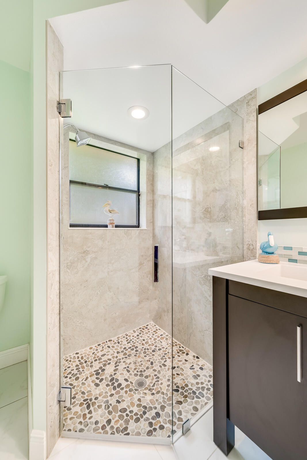 23250 Sedawie Drive Boca Raton, FL 33433 - Photo 27 of 42 a bathroom with a shower sink and mirror