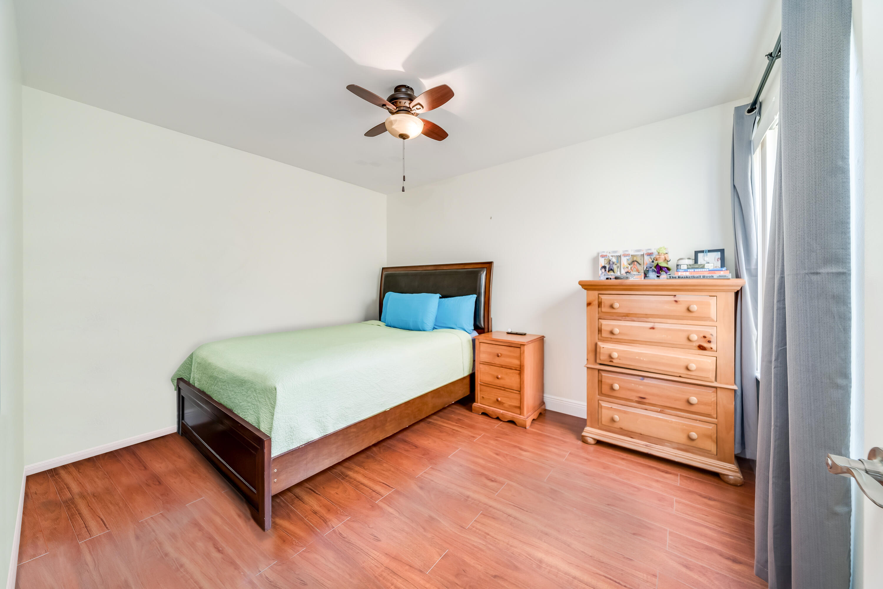 23250 Sedawie Drive Boca Raton, FL 33433 - Photo 28 of 42 a bedroom with a bed and a cabinets