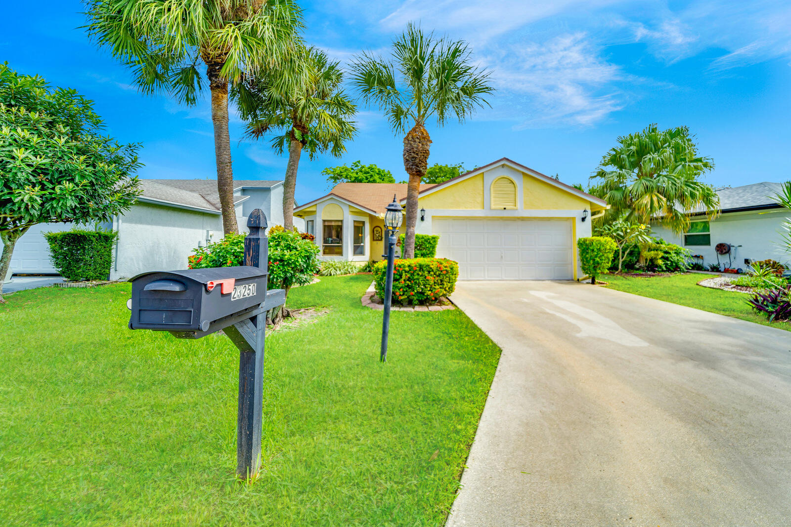 23250 Sedawie Drive Boca Raton, FL 33433 - Photo 3 of 42 a house view with a garden space