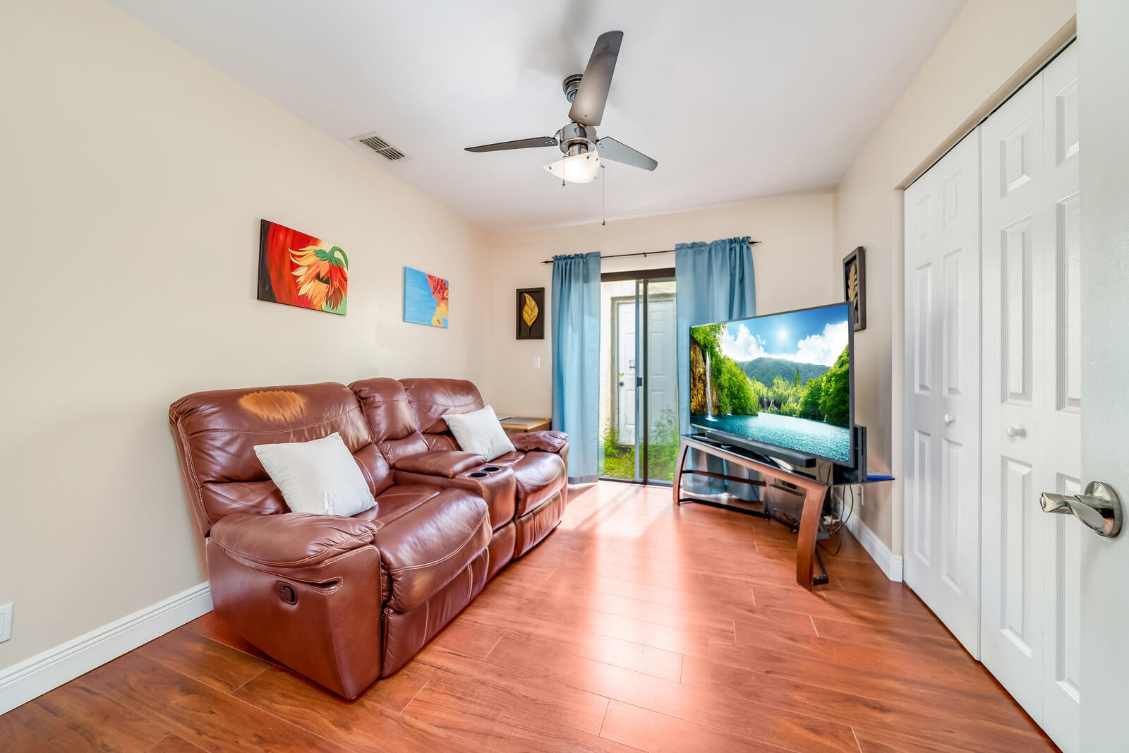 23250 Sedawie Drive Boca Raton, FL 33433 - Photo 31 of 42 a living room with furniture and a flat screen tv