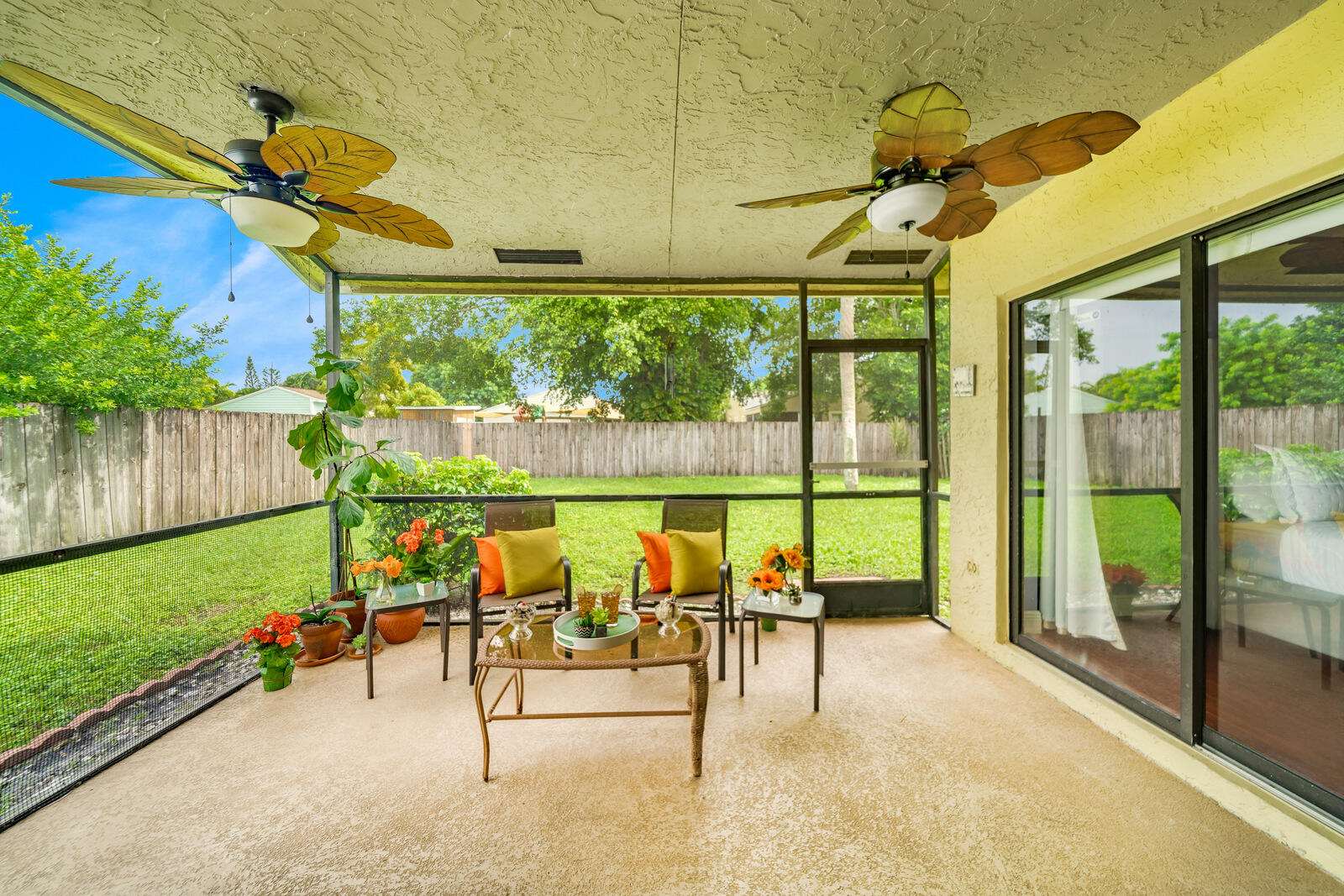 23250 Sedawie Drive Boca Raton, FL 33433 - Photo 33 of 42 a view of a patio with a table chairs and a garden