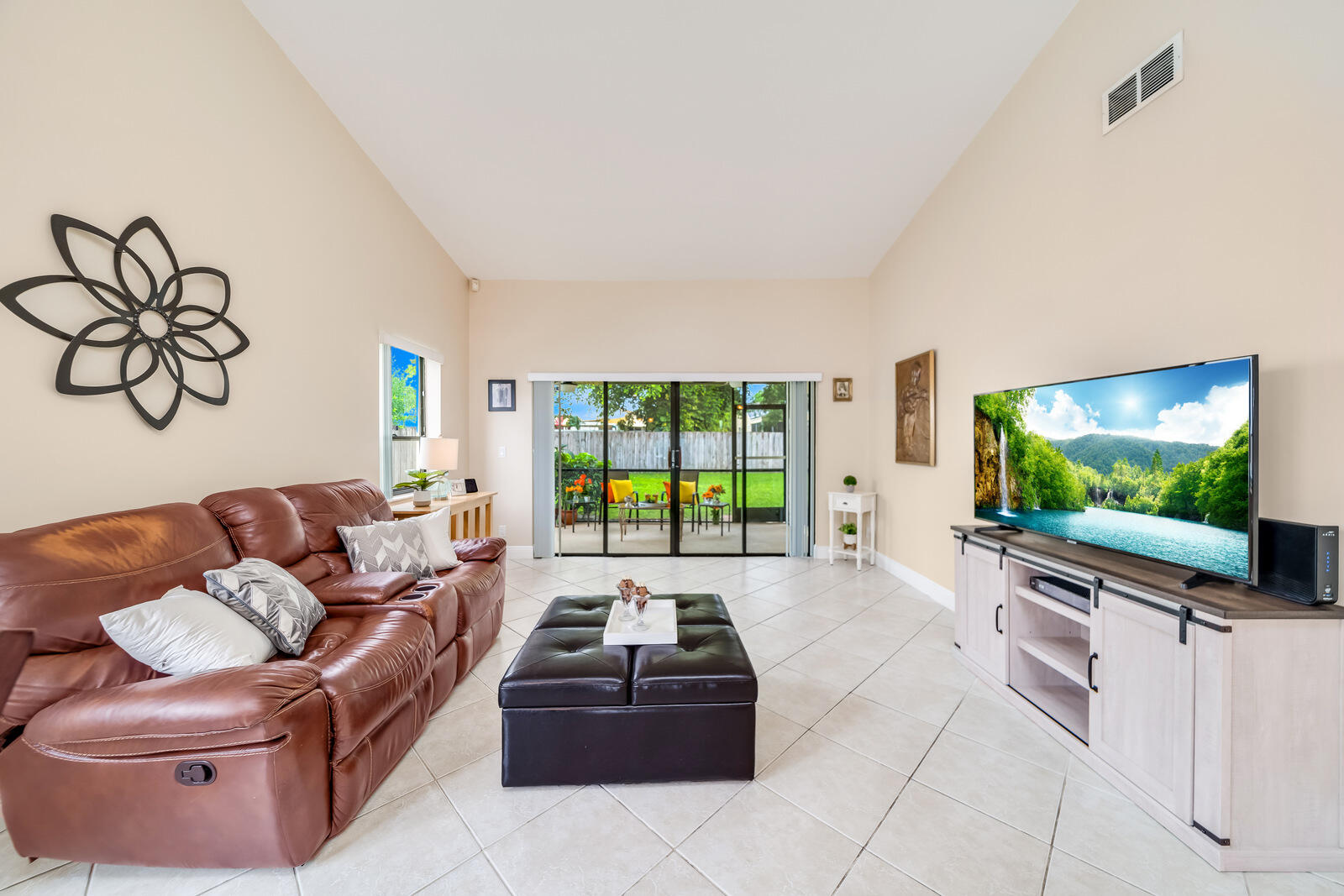 23250 Sedawie Drive Boca Raton, FL 33433 - Photo 9 of 42 a living room with furniture and a flat screen tv