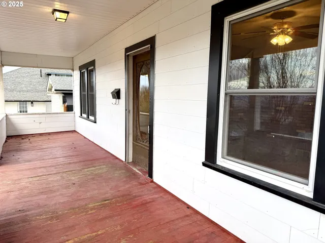 a view of a living room with a wooden floor