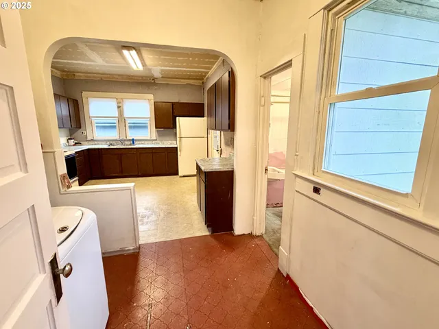 view of living room with furniture and large window