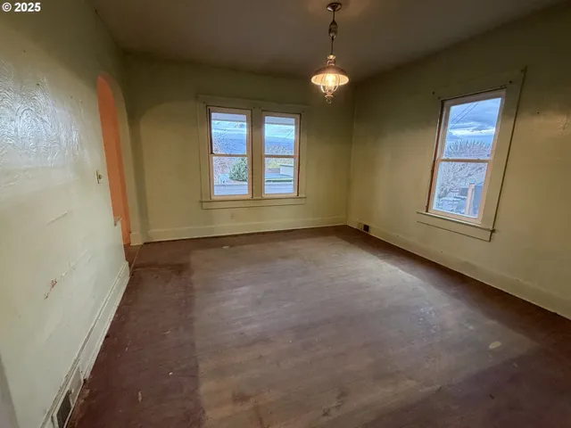 an empty room with windows