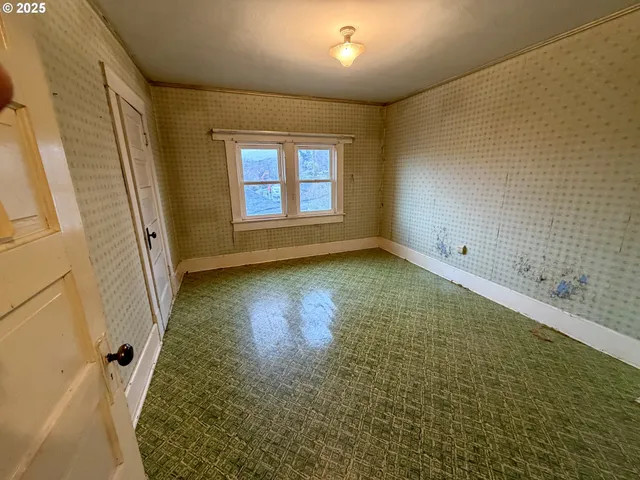 a view of a hallway with stairs