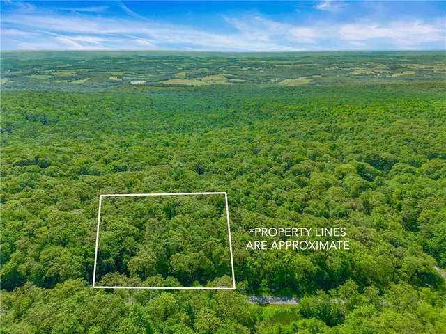 a view of a field with an outdoor space