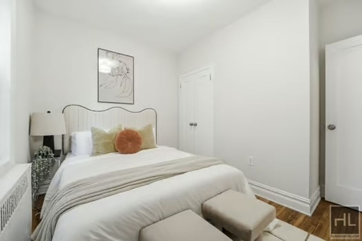 160 East 3rd Street, Unit 2F Manhattan, NY 10009 - Photo 11 of 20 a bedroom with a bed and a window