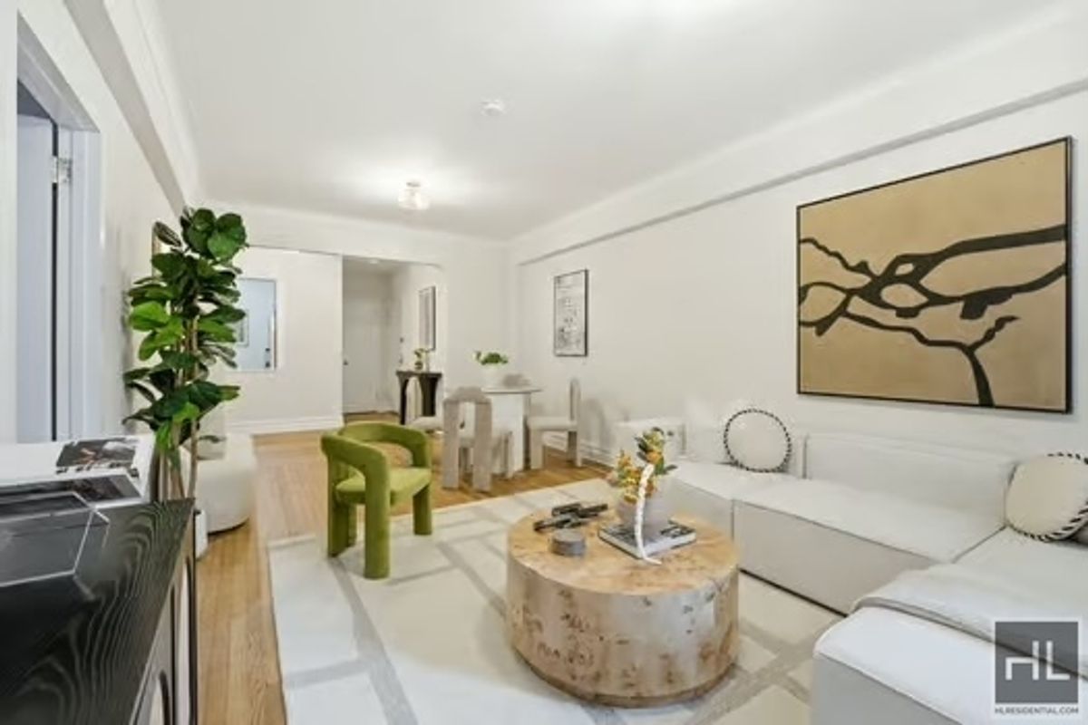 160 East 3rd Street, Unit 2F Manhattan, NY 10009 - Photo 3 of 20 a living room with furniture and flowers