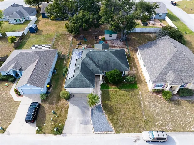 an aerial view of a house with a garden