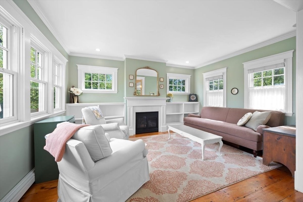 13 Ship Street Hingham, MA 02043 - Photo 12 of 37 a living room with furniture and a fireplace