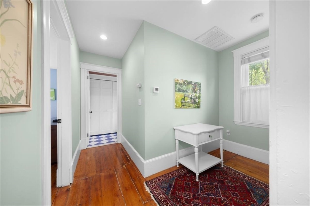 13 Ship Street Hingham, MA 02043 - Photo 21 of 37 a living room with a furniture and a rug
