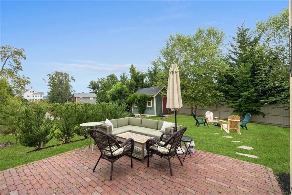 13 Ship Street Hingham, MA 02043 - Photo 30 of 37 a view of a dinning table and chairs in the garden