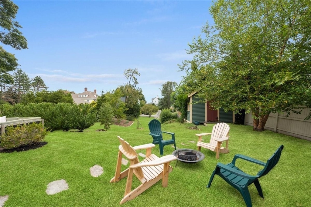 13 Ship Street Hingham, MA 02043 - Photo 33 of 37 a view of a table and chairs in backyard