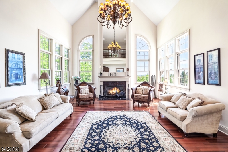 2 Chilton Road Chester, NJ 07930 - Photo 5 of 43 a living room with furniture fireplace and a large window