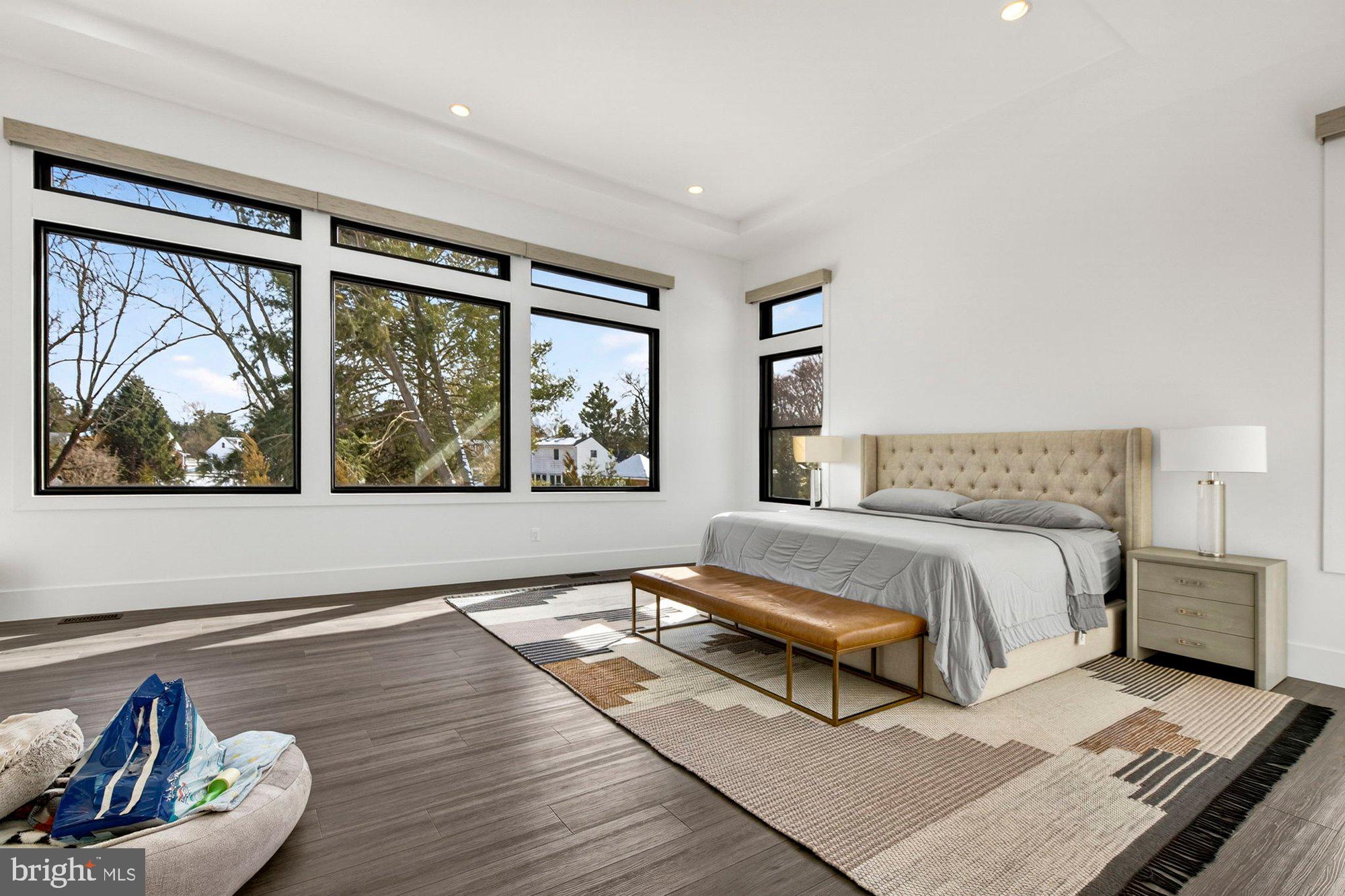 1221 Riley Preserve Court McLean, VA 22102 - Photo 23 of 94 a spacious bedroom with a bed and a window