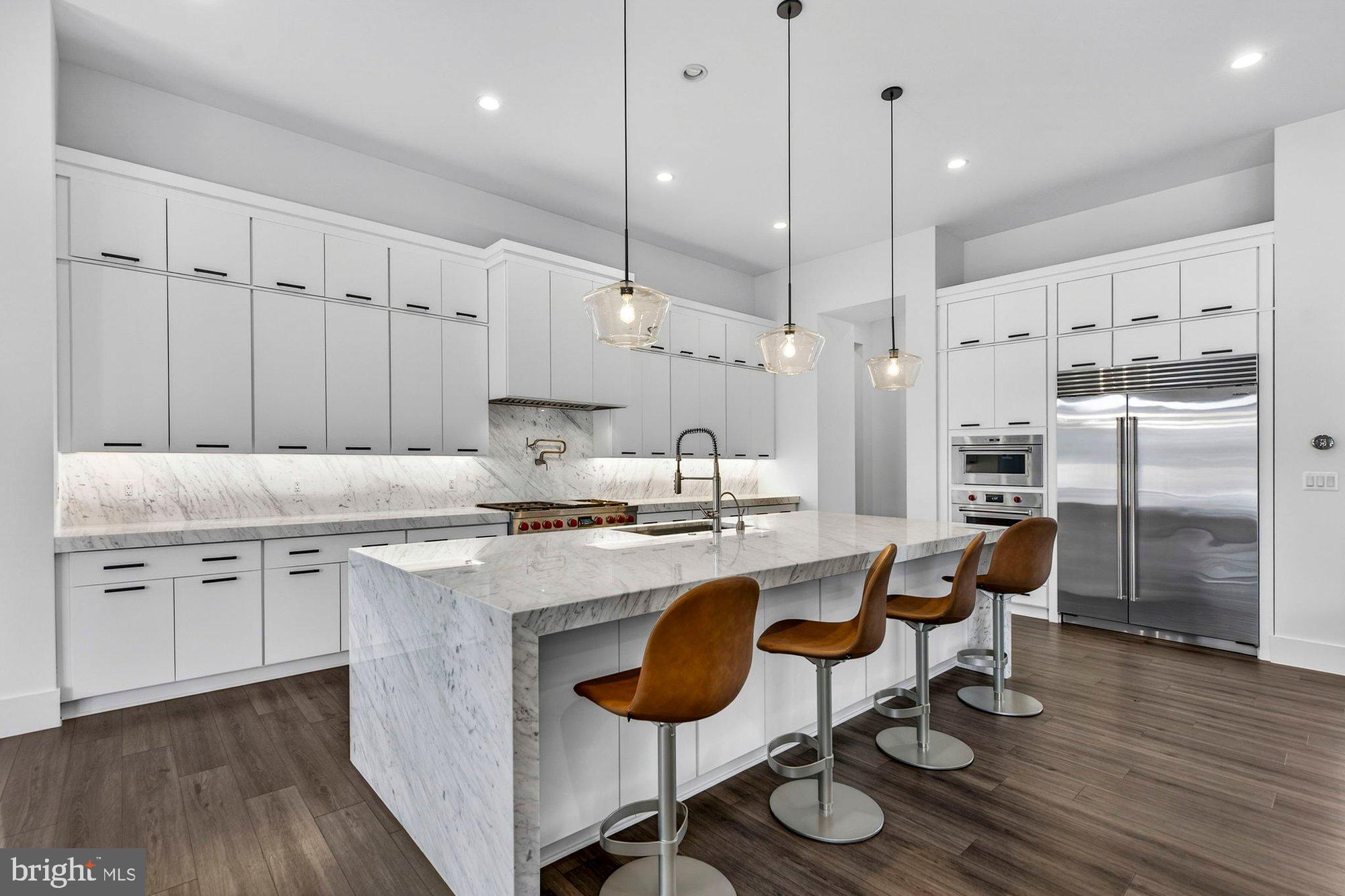 1221 Riley Preserve Court McLean, VA 22102 - Photo 3 of 94 a kitchen with stainless steel appliances granite countertop a white cabinets and wooden floors