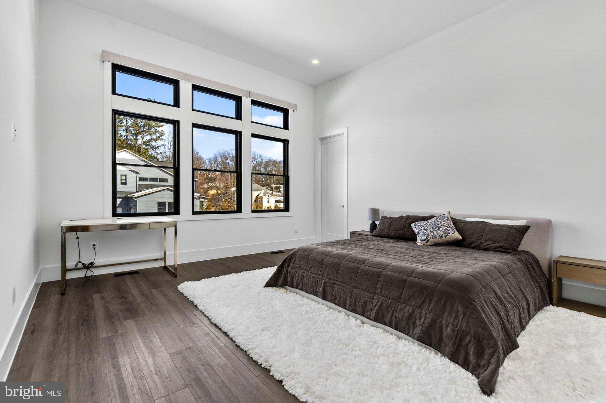 1221 Riley Preserve Court McLean, VA 22102 - Photo 41 of 94 a bedroom with a bed and a large window