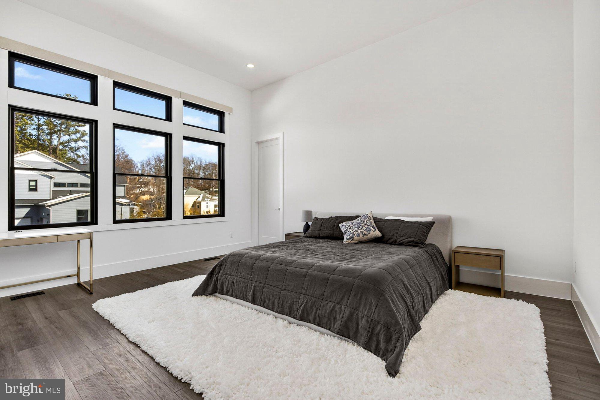 1221 Riley Preserve Court McLean, VA 22102 - Photo 42 of 94 a bedroom with a large bed and a large window
