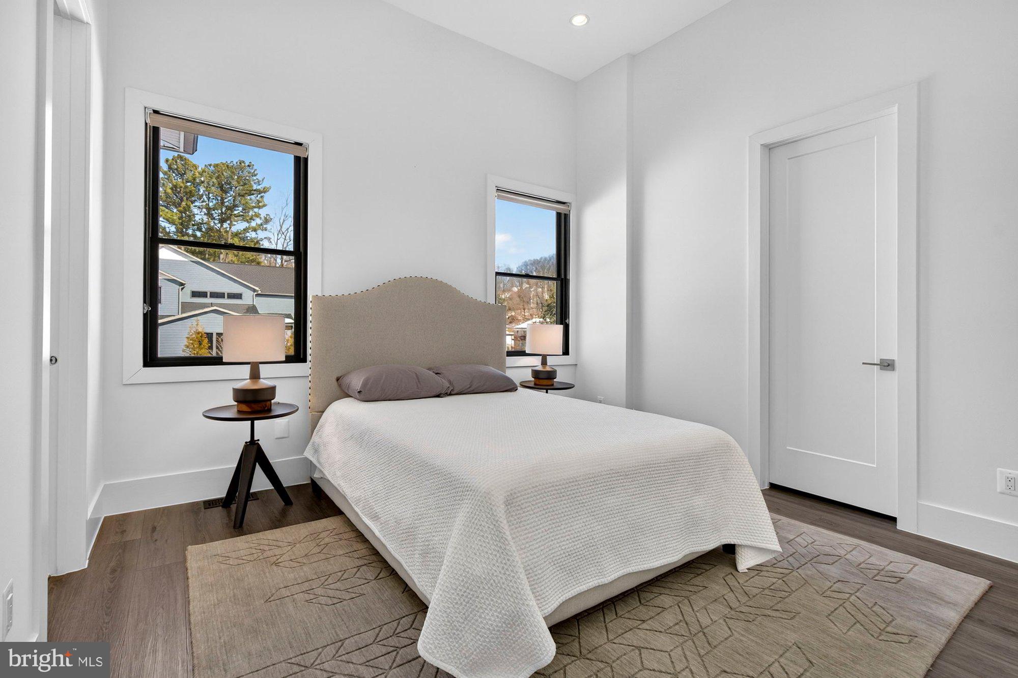 1221 Riley Preserve Court McLean, VA 22102 - Photo 47 of 94 a bedroom with a bed and a painting on the wall