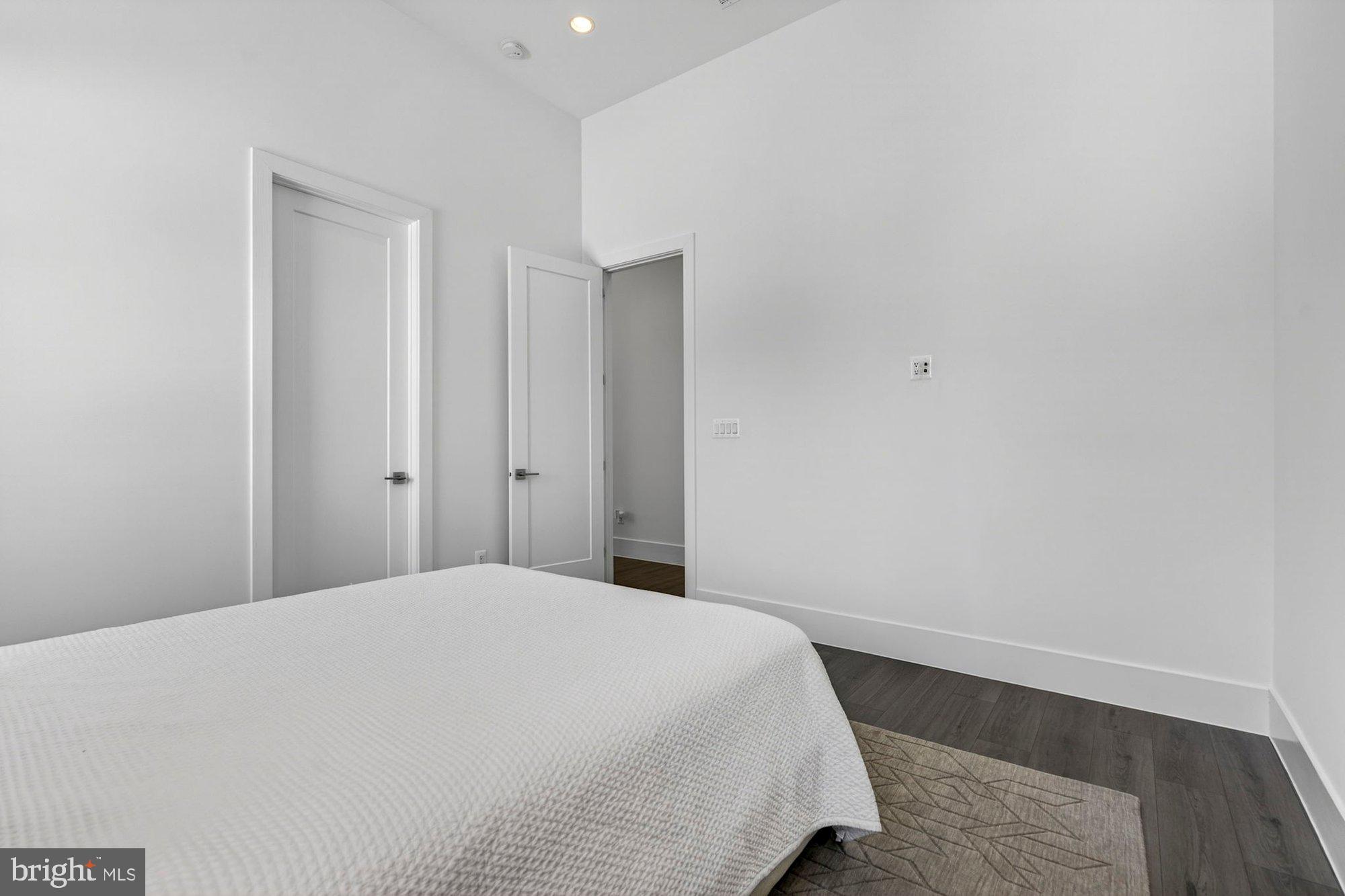 1221 Riley Preserve Court McLean, VA 22102 - Photo 48 of 94 a bedroom with a bed and wooden floor