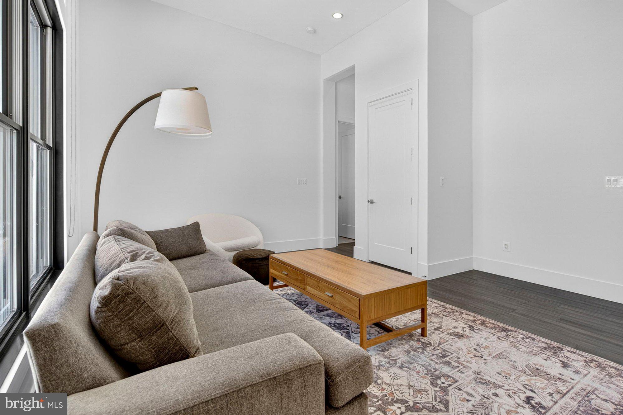 1221 Riley Preserve Court McLean, VA 22102 - Photo 50 of 94 a living room with furniture and a wooden floor