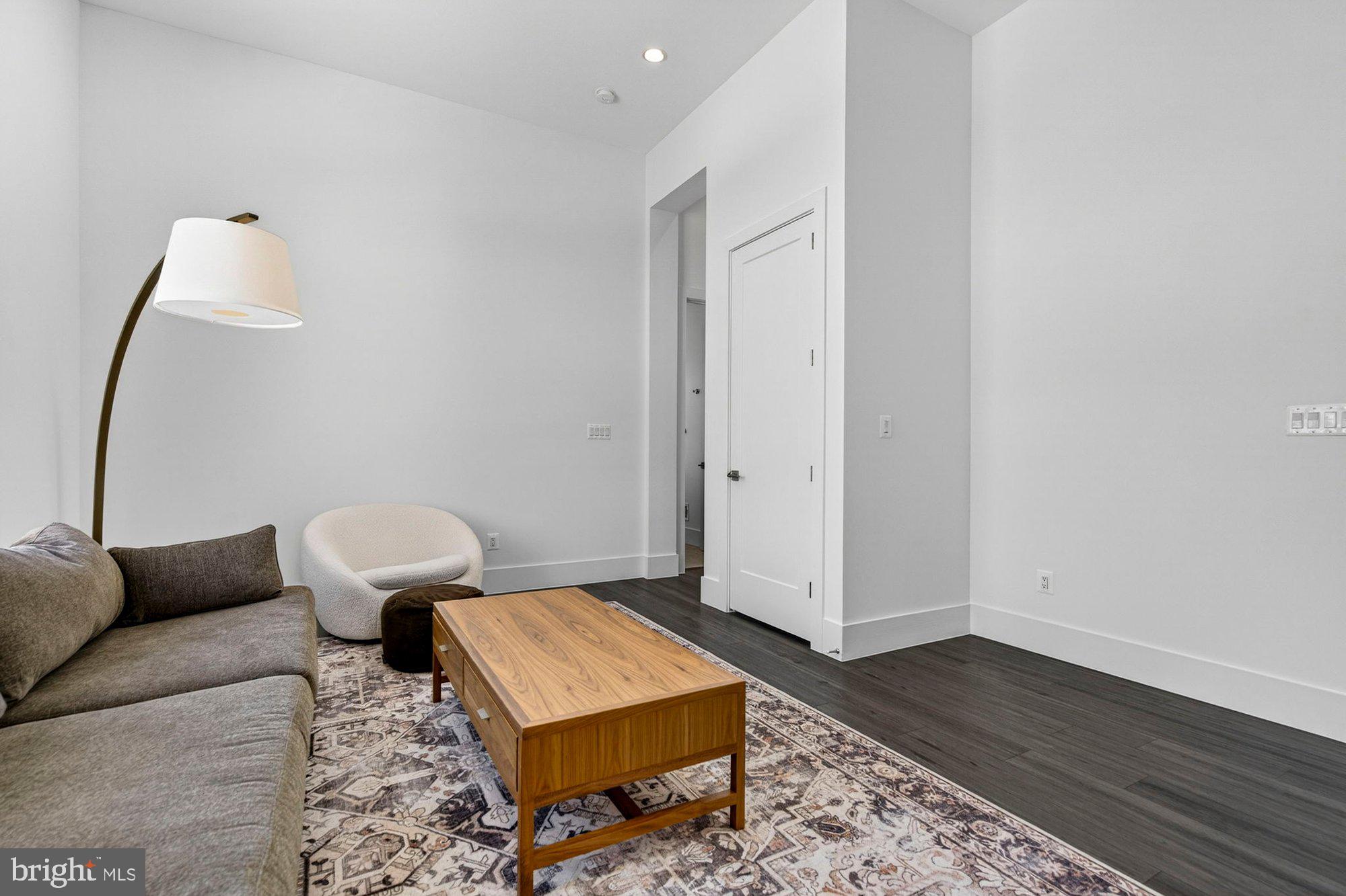 1221 Riley Preserve Court McLean, VA 22102 - Photo 51 of 94 a living room with furniture and a rug