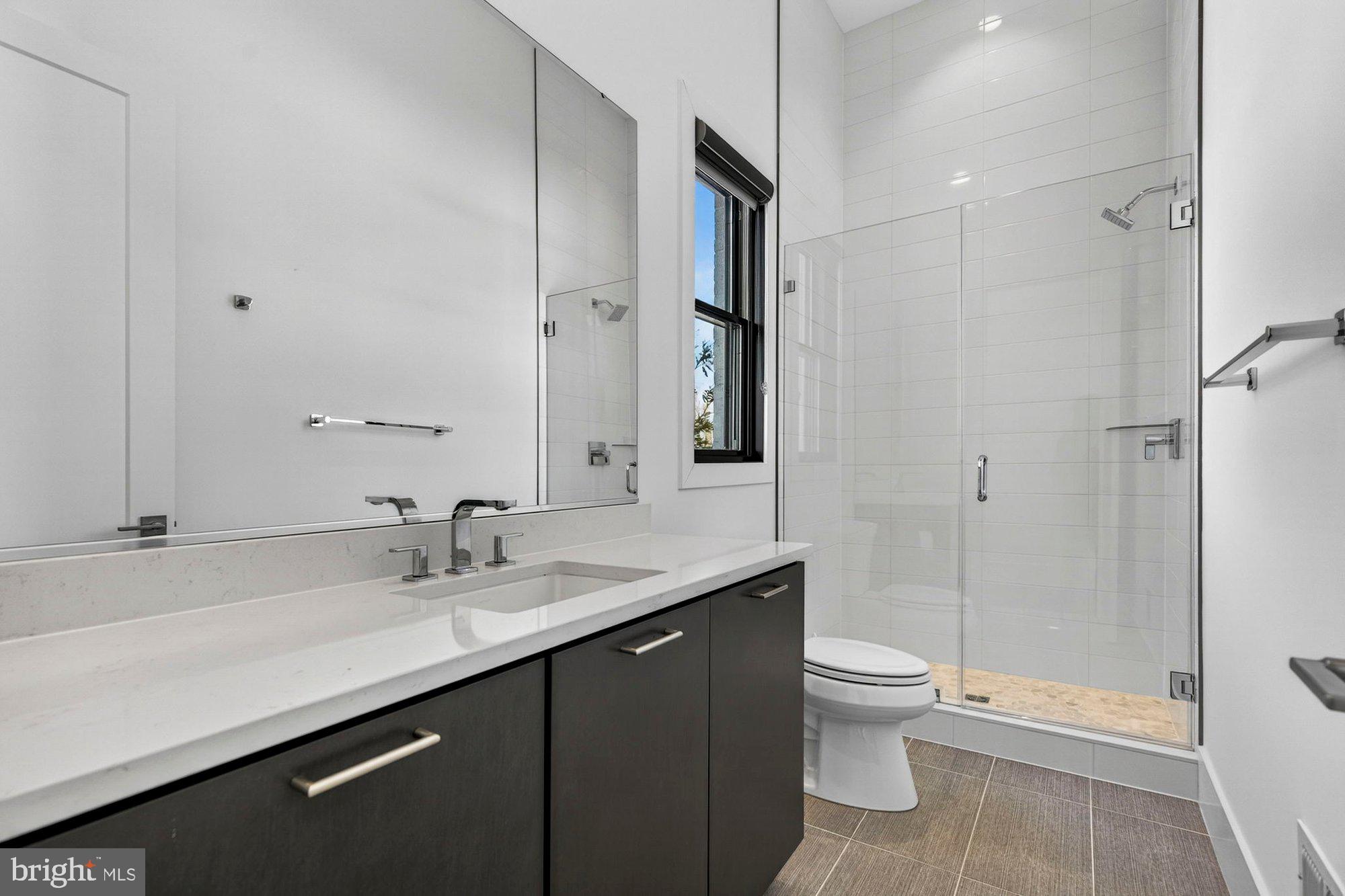 1221 Riley Preserve Court McLean, VA 22102 - Photo 54 of 94 a bathroom with a sink a toilet a tub and shower