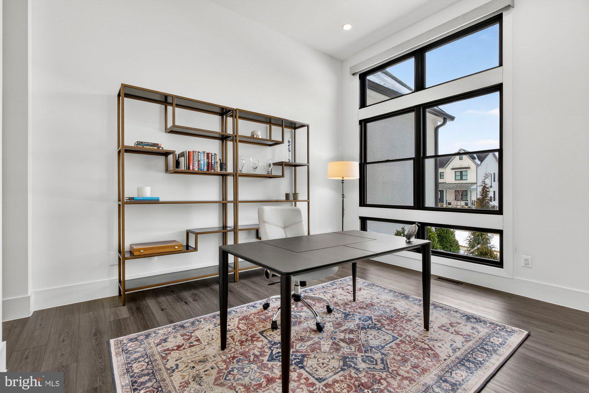 1221 Riley Preserve Court McLean, VA 22102 - Photo 7 of 94 a view of a workspace room with furniture wooden floor and window