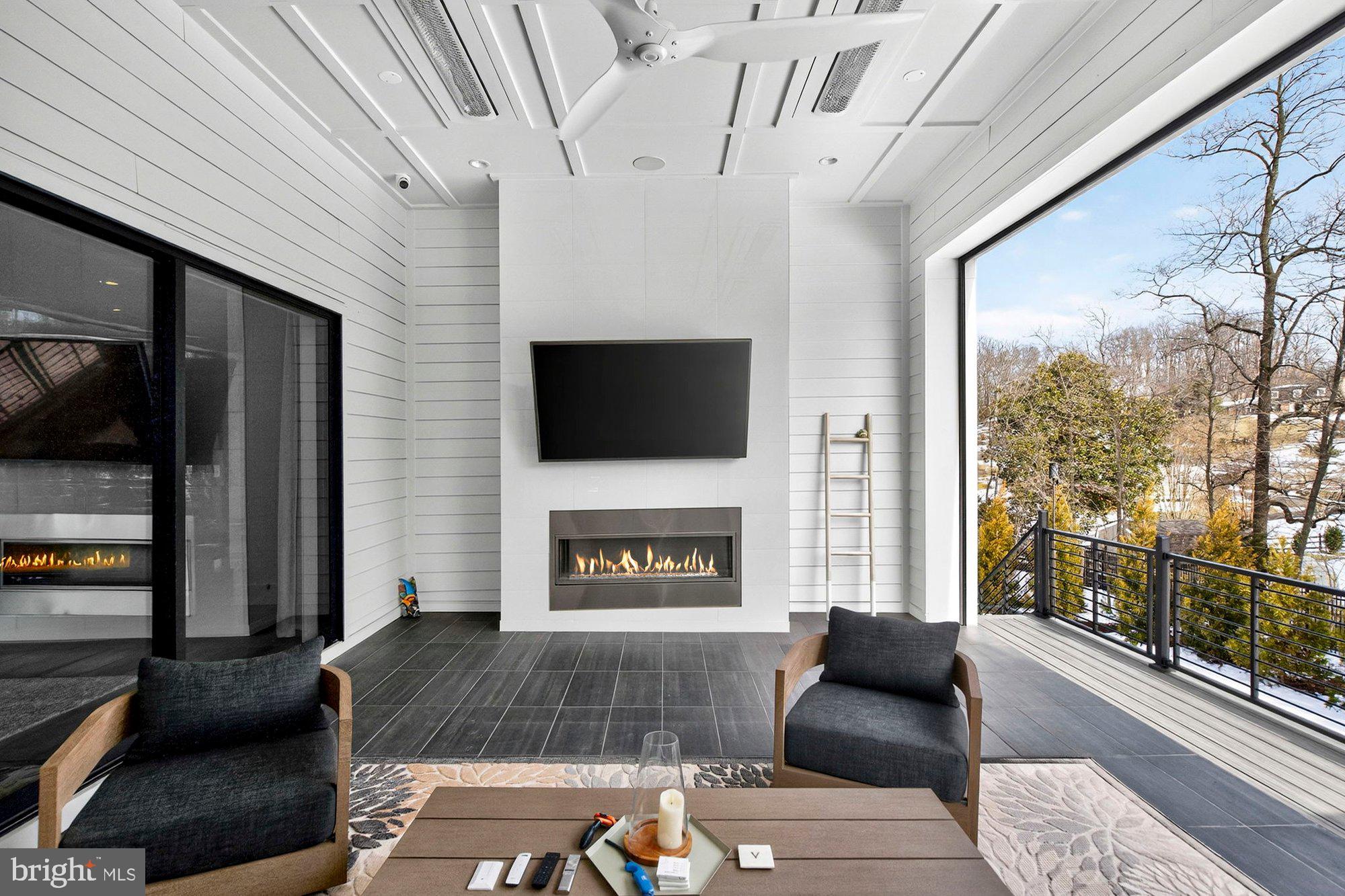 1221 Riley Preserve Court McLean, VA 22102 - Photo 79 of 94 a living room with furniture a flat screen tv and a fireplace