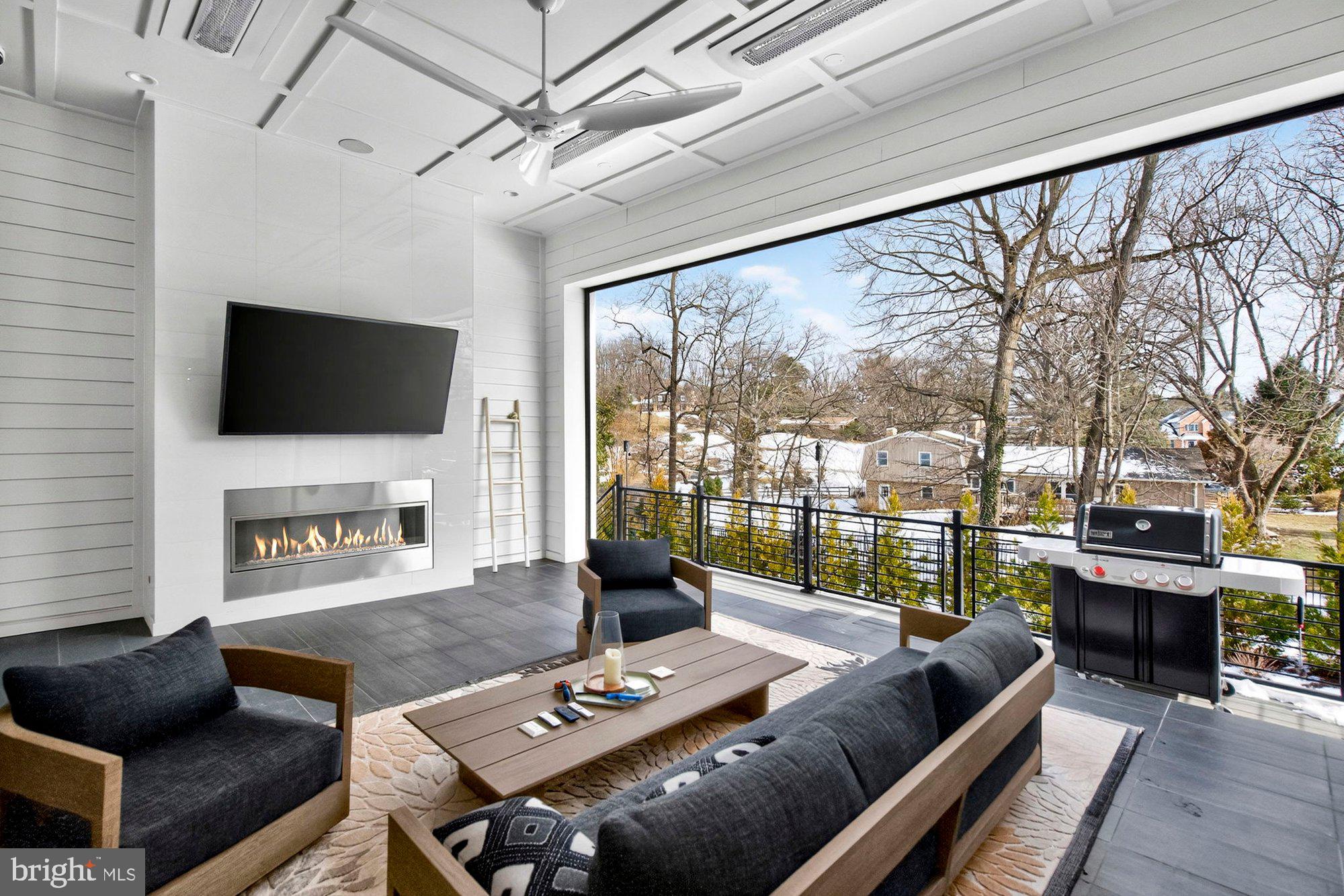 1221 Riley Preserve Court McLean, VA 22102 - Photo 80 of 94 a living room with fireplace furniture and a flat screen tv
