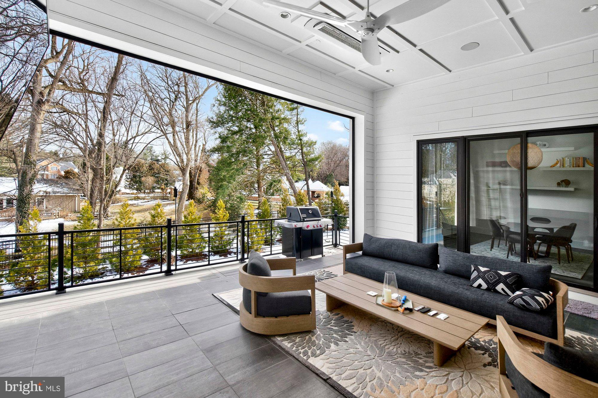 1221 Riley Preserve Court McLean, VA 22102 - Photo 81 of 94 a living room with furniture and a floor to ceiling window