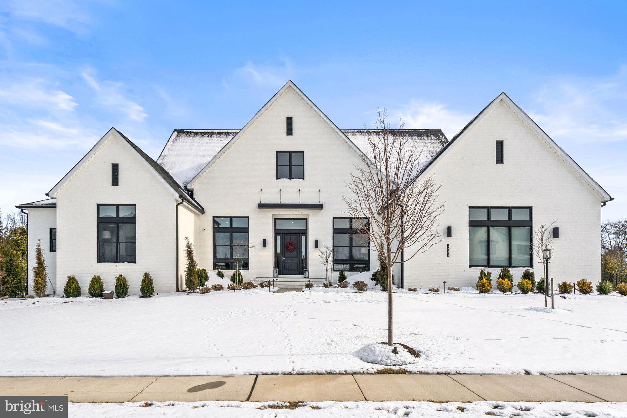 1221 Riley Preserve Court McLean, VA 22102 - Photo 89 of 94 a view of a white house with large windows