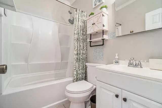 a bathroom with a sink a toilet and a bathtub