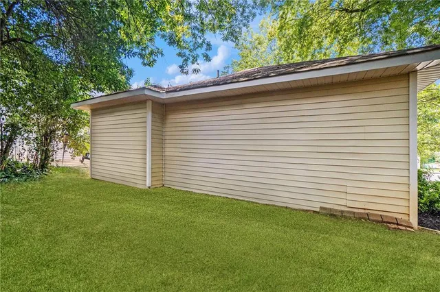 a view of a backyard with a large tree