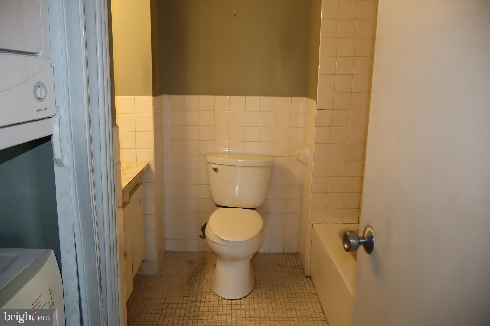 3600 Conshohocken Avenue, Unit 1004 Philadelphia, PA 19131 - Photo 14 of 17 a bathroom with a toilet and a sink