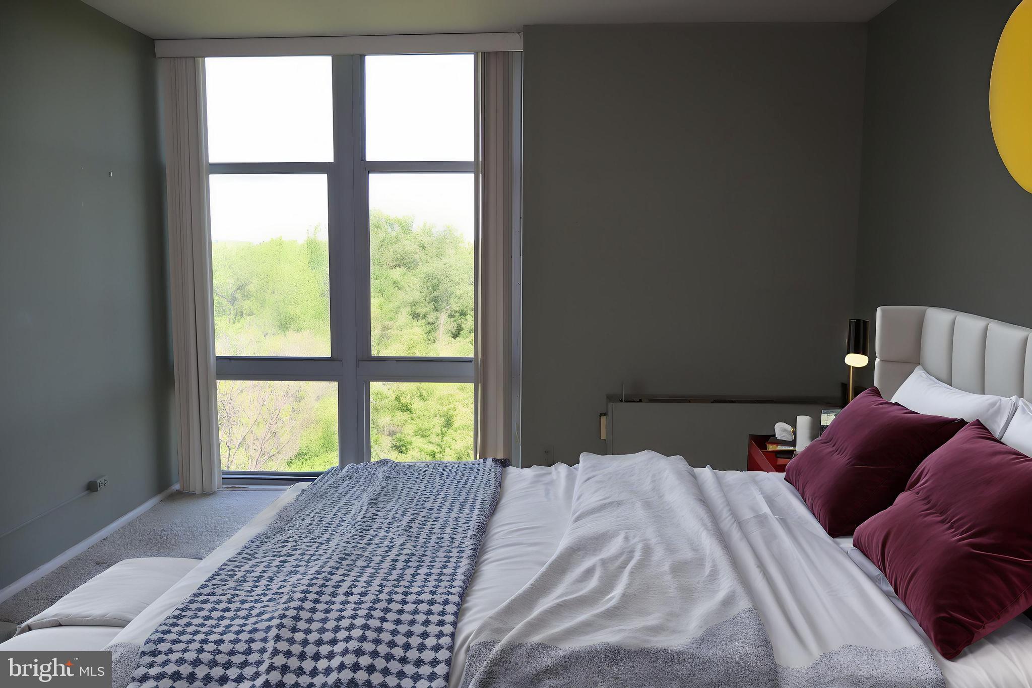 3600 Conshohocken Avenue, Unit 1004 Philadelphia, PA 19131 - Photo 16 of 17 a bedroom with a bed and a window