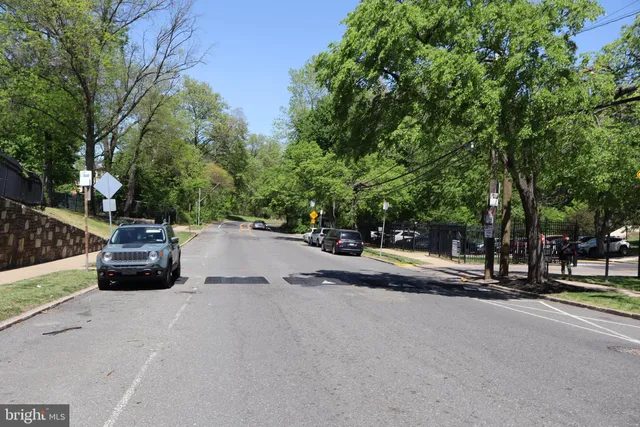 a view of street with parked cars