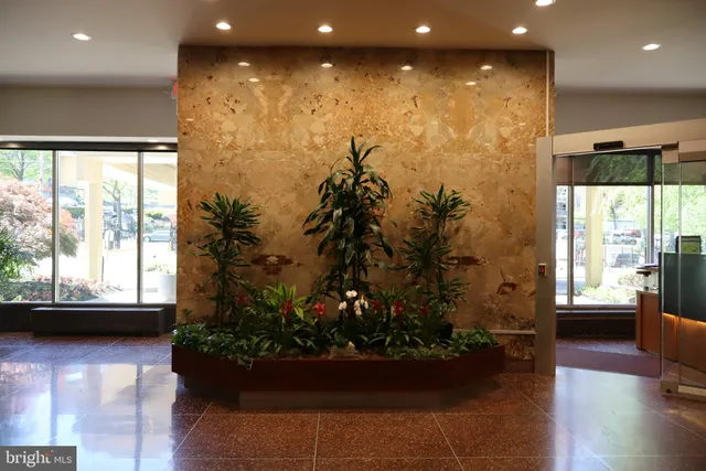 a view of a living room and floor to ceiling window or wooden floor