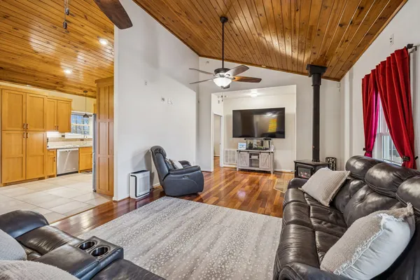 a kitchen with stainless steel appliances a refrigerator and microwave