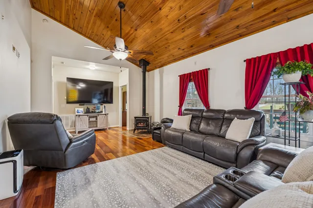 a kitchen with stainless steel appliances granite countertop a refrigerator sink and stove