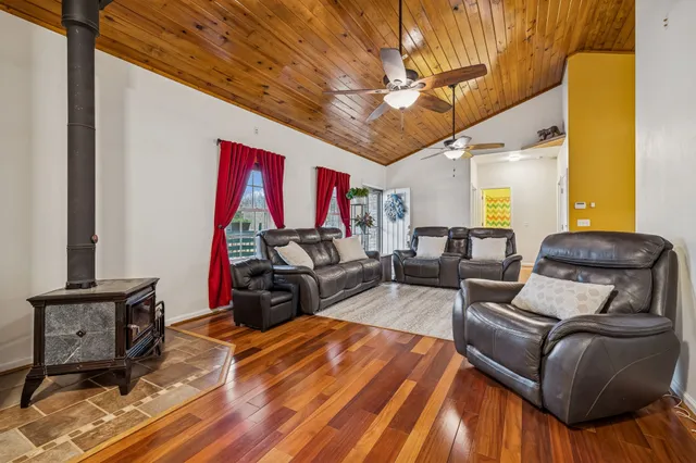 a view of a workspace with furniture and a book shelf