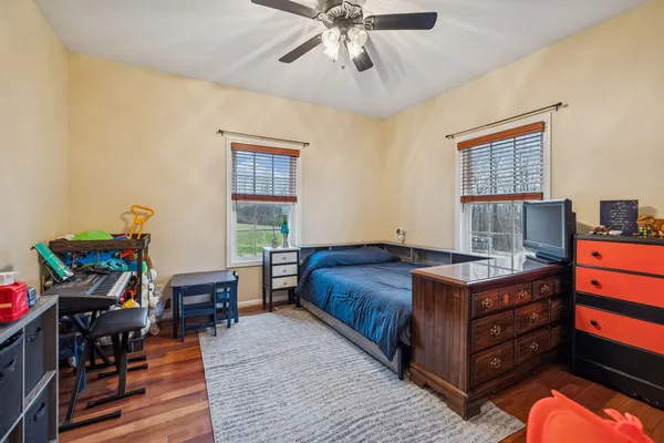 a view of livingroom with hardwood floor and workspace
