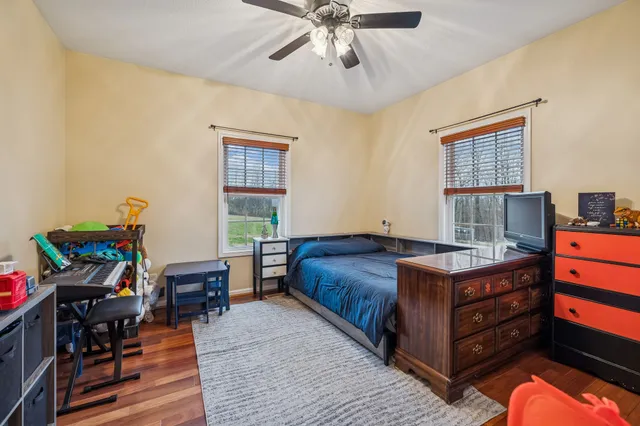 a view of livingroom with hardwood floor and workspace