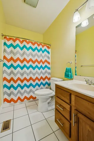 a view of a house with backyard and trees