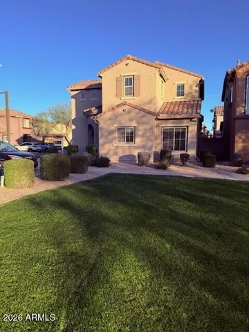 a view of a garden with sitting area