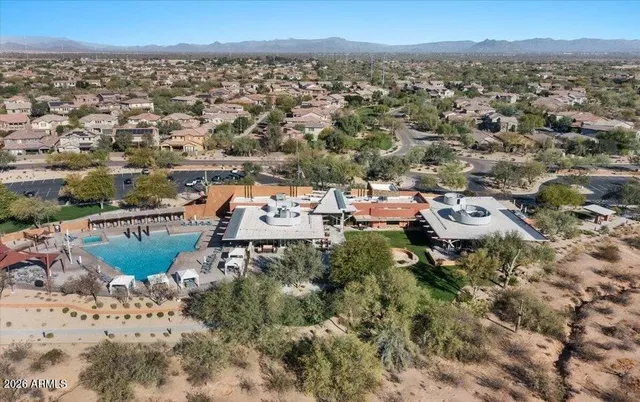 a view of a swimming pool with a patio