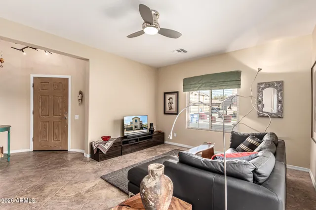 a living room with furniture and a large window