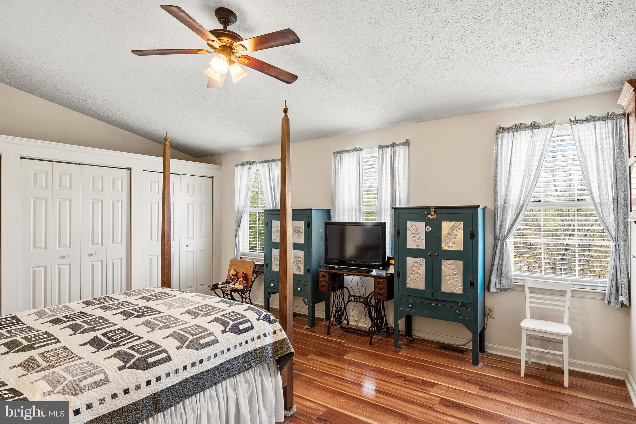 6415 Michael Elizabeth Way Hanover, MD 21076 - Photo 19 of 32 a bedroom with a bed piano and a chandelier