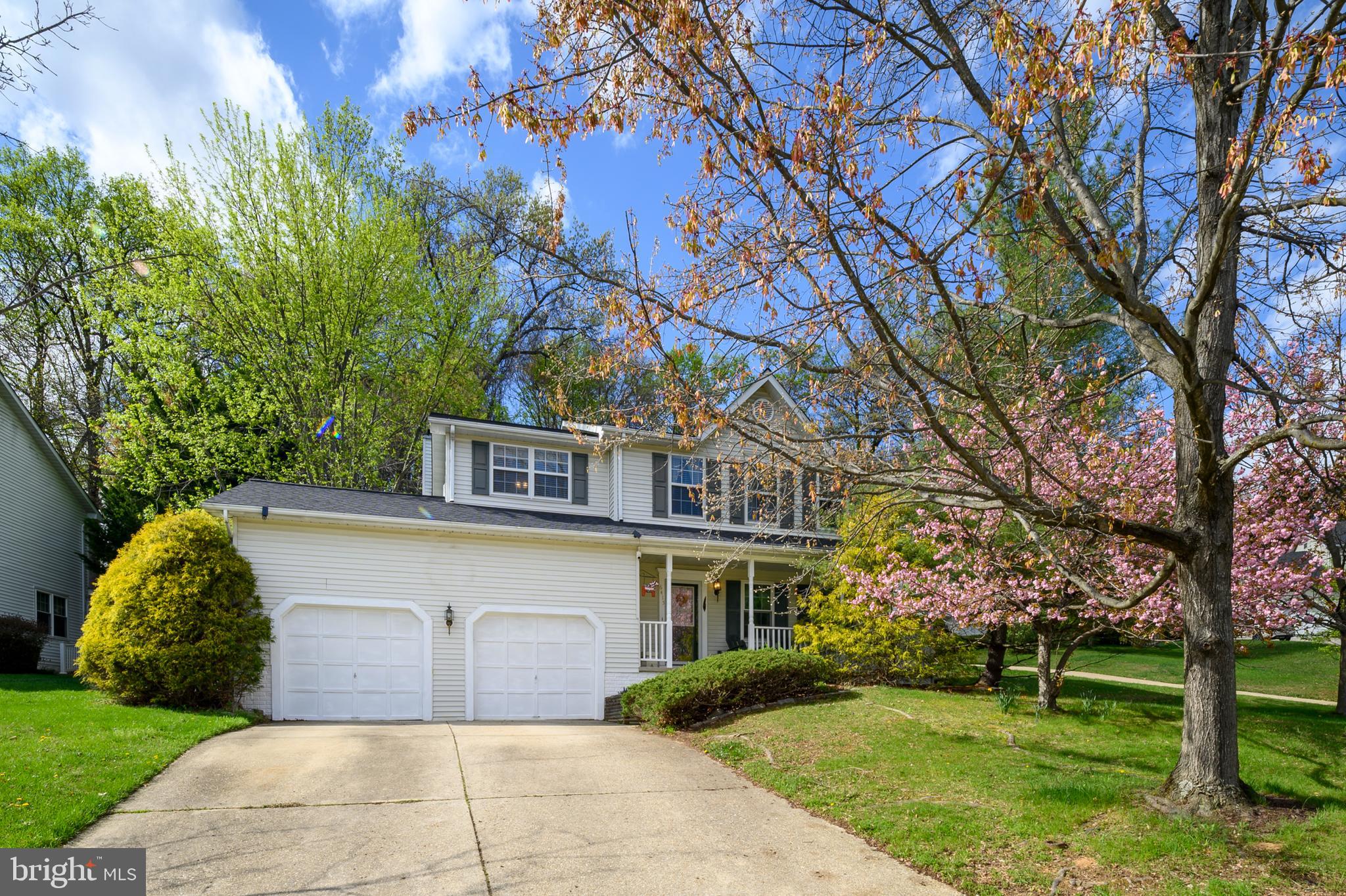 6415 Michael Elizabeth Way Hanover, MD 21076 - Photo 2 of 32 a front view of a house with garden